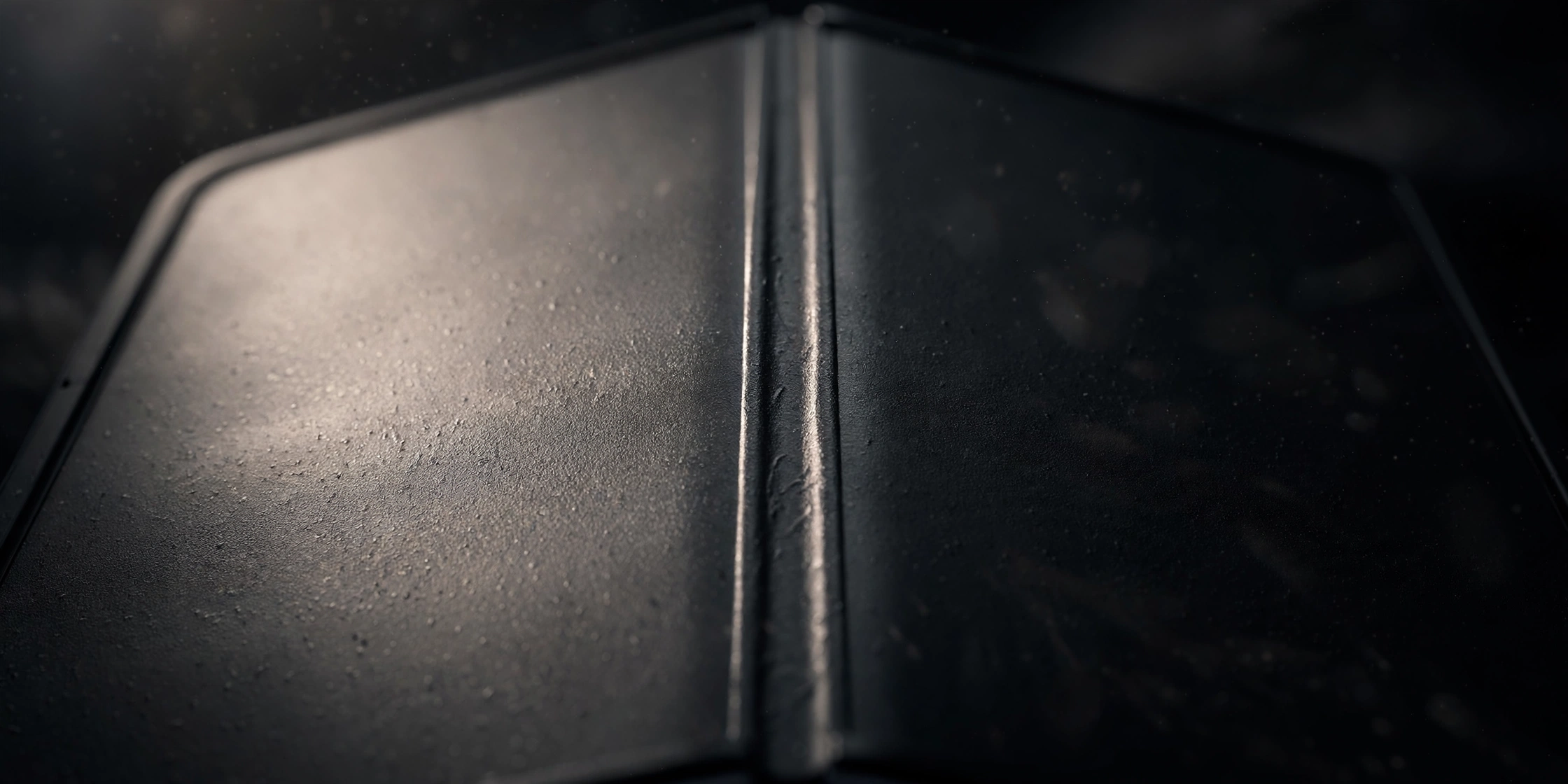 Close-up of the iPhone Duo's inner display, its matte nano-texture surface scattering light across the crease